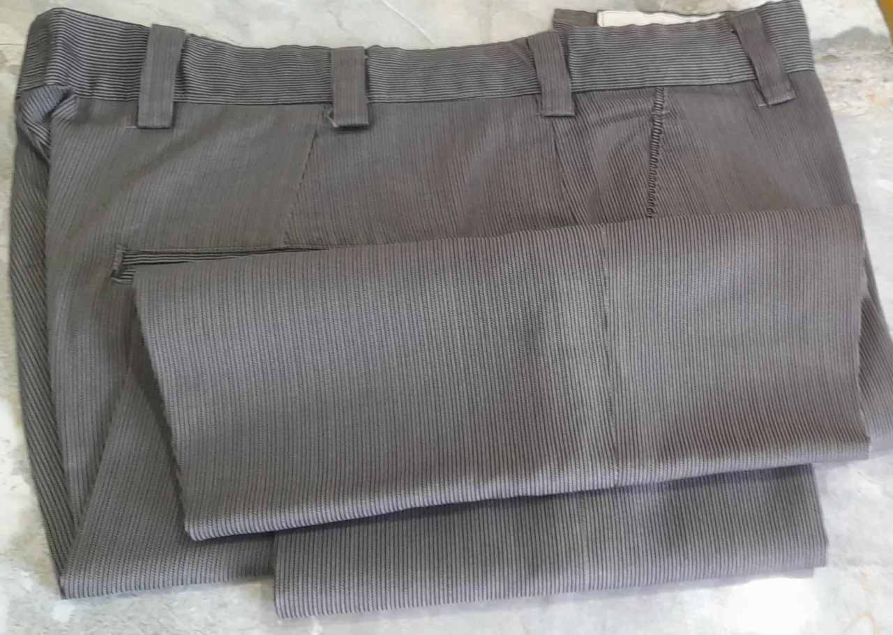 7 Men's used formal pants.