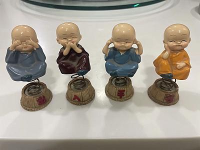 four laughing Buddha set