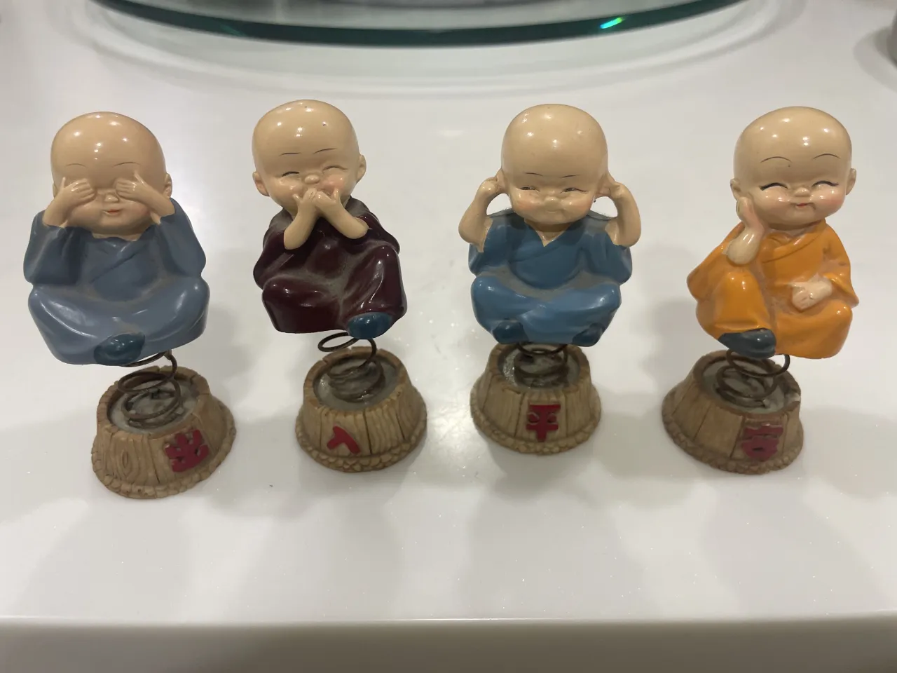 four laughing Buddha set
